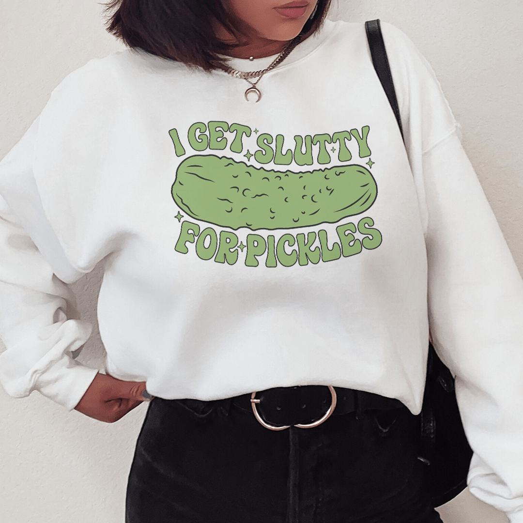 Cozy 'I Get Slutty For Pickles' sweatshirt featuring a playful pickle design, perfect for casual wear.