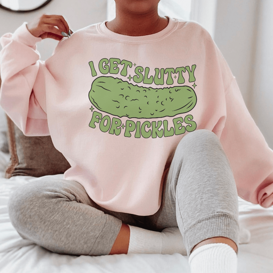 Cozy 'I Get Slutty For Pickles' sweatshirt featuring a playful pickle design, perfect for casual wear.