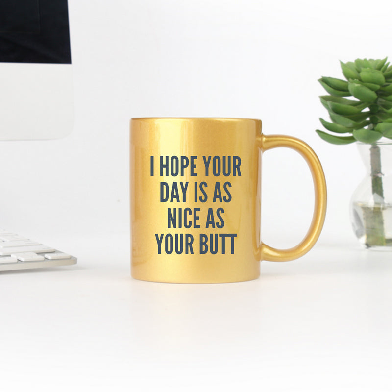 Ceramic gold and silver mug with humorous text design, perfect for coffee or tea.