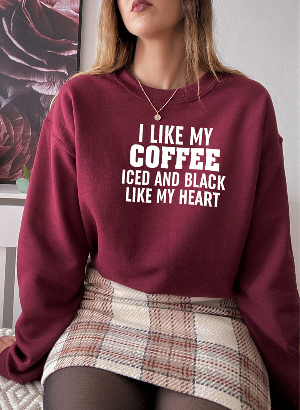 I Like My Coffee Iced And Black Like My Heart Sweat Shirt featuring a unique coffee-themed design in a cozy fleece material.