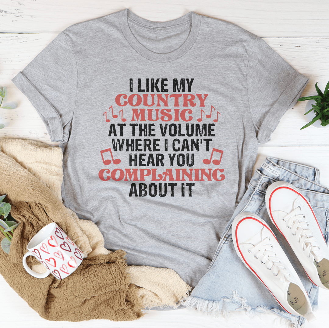 A comfortable and stylish t-shirt featuring the phrase 'I Like My Country Music At The Volume Where I Can't Hear You', made from soft ring-spun cotton.