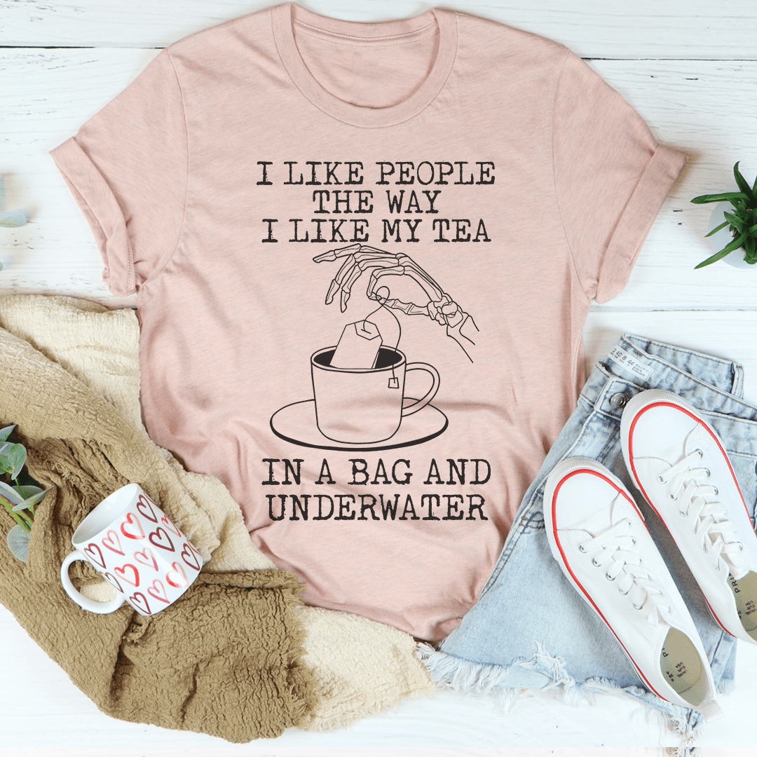 A comfortable and stylish t-shirt with the slogan 'I Like People The Way I Like My Tea' printed on it, made from soft ring-spun cotton.