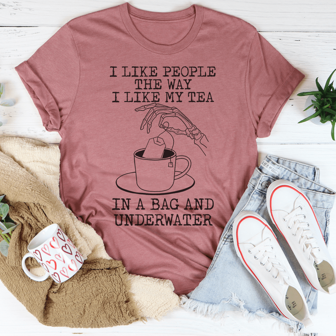 A comfortable and stylish t-shirt with the slogan 'I Like People The Way I Like My Tea' printed on it, made from soft ring-spun cotton.