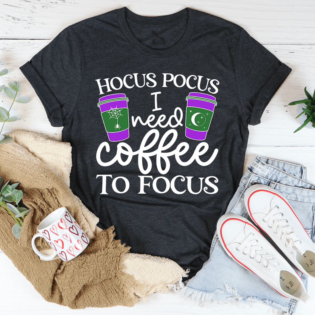 A comfortable 'I Need Coffee To Focus' T-Shirt made from soft ring-spun cotton, featuring a humorous coffee-themed design.