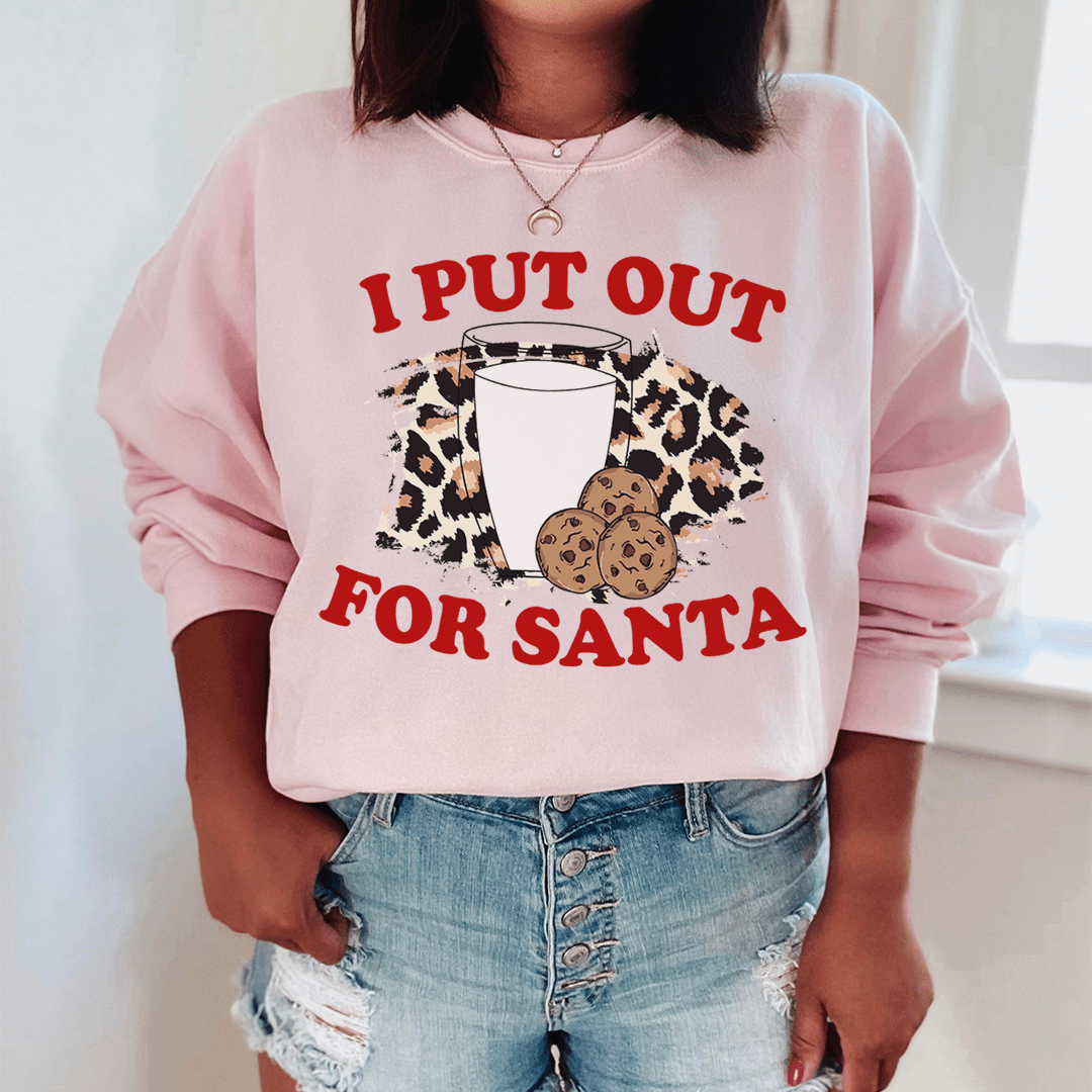 A cozy 'I Put Out For Santa' sweatshirt featuring a festive design, made from a soft cotton/poly fleece blend, perfect for holiday celebrations.