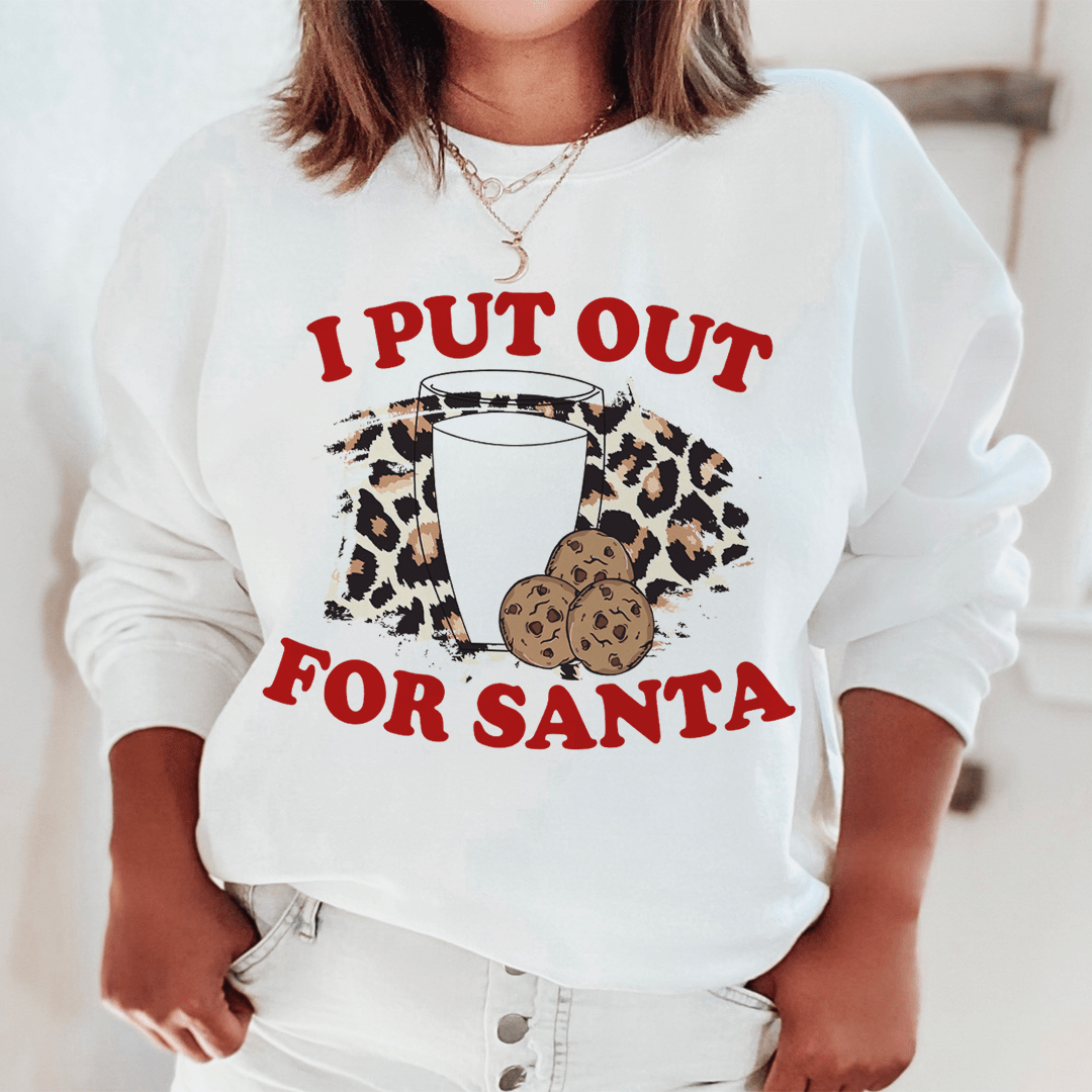 A cozy 'I Put Out For Santa' sweatshirt featuring a festive design, made from a soft cotton/poly fleece blend, perfect for holiday celebrations.