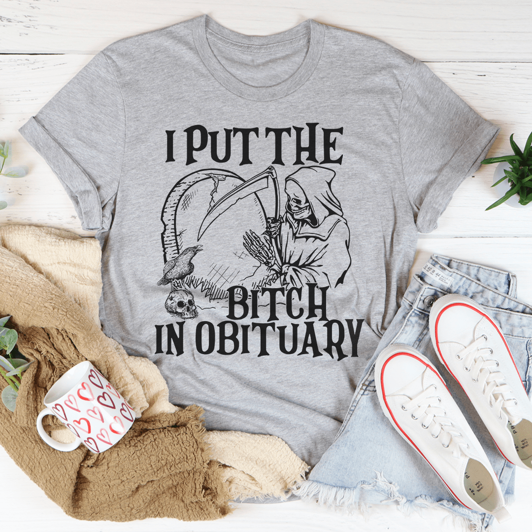 I Put The B In Obituary T-Shirt displayed on a mannequin, showcasing its comfortable fit and unique design.