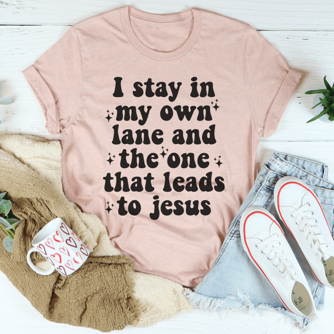 I Stay In My Own Lane Tee made of soft ring-spun cotton, featuring double stitching for durability, available in various sizes.