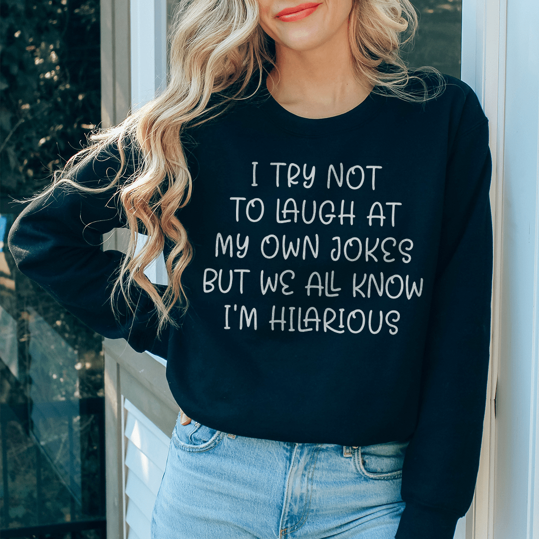 Cozy sweatshirt featuring the phrase 'I Try Not To Laugh At My Own Jokes', designed by top artists, showcasing a stylish and humorous design.