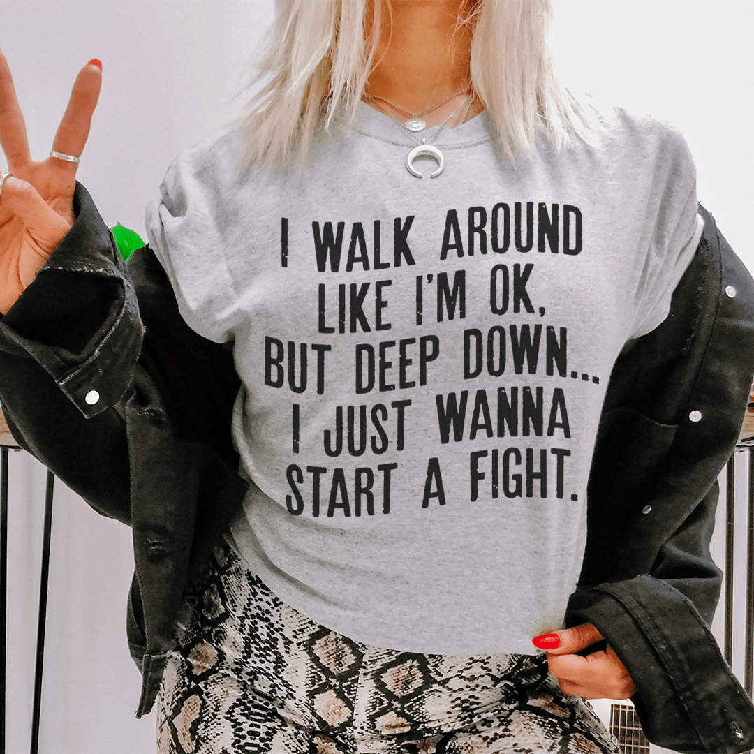 I Walk Around Like I'm Ok Tee, a soft ring-spun cotton t-shirt with durable double stitching, available in various sizes.