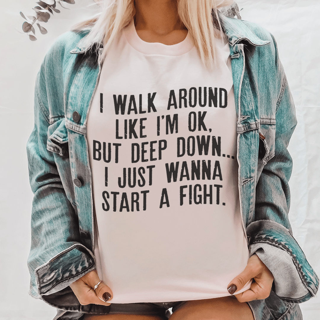 I Walk Around Like I'm Ok Tee, a soft ring-spun cotton t-shirt with durable double stitching, available in various sizes.