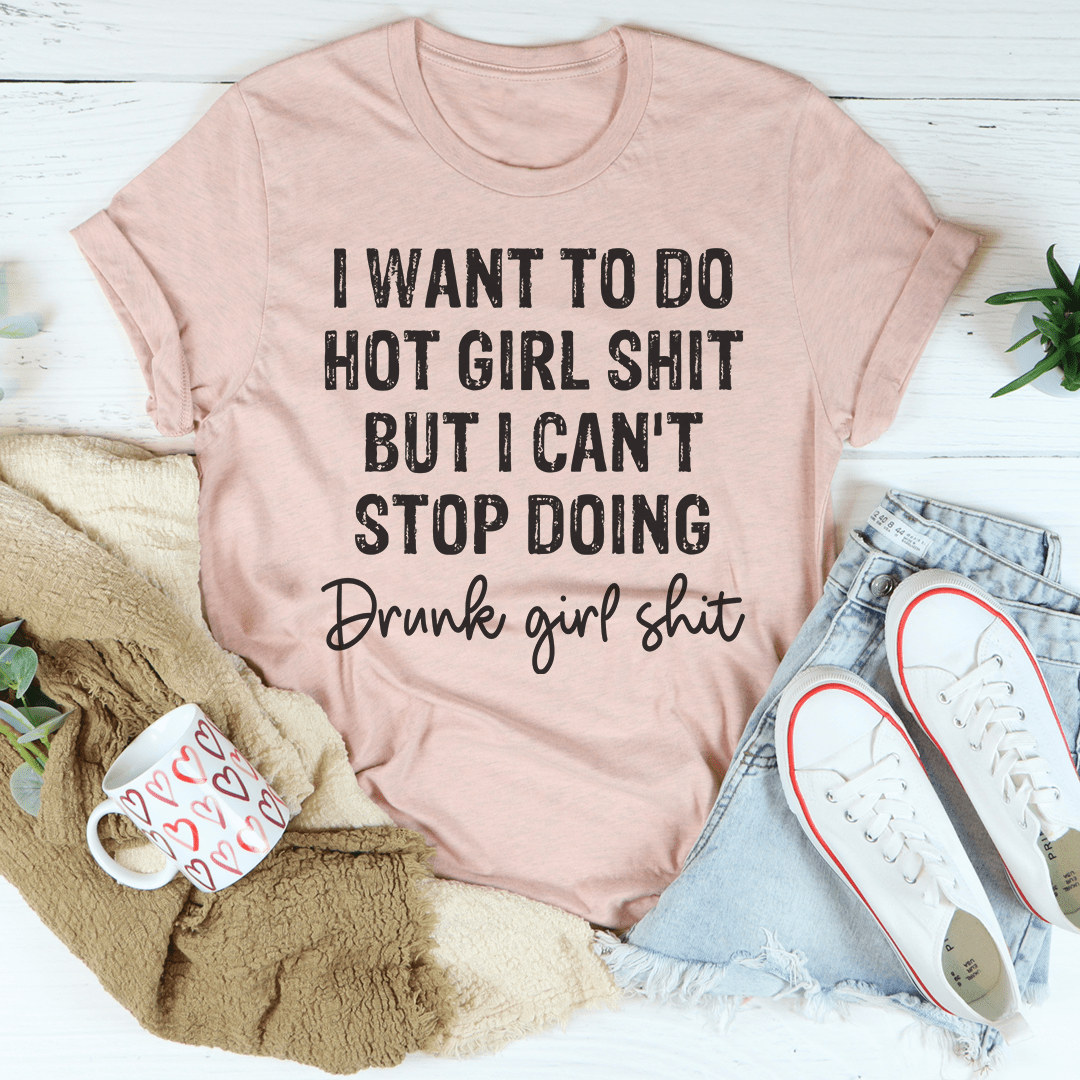 A stylish t-shirt featuring the slogan 'I Want To Do Hot Girl Stuff But I Can't Stop Doing Drunk Girl Stuff', made from soft cotton.