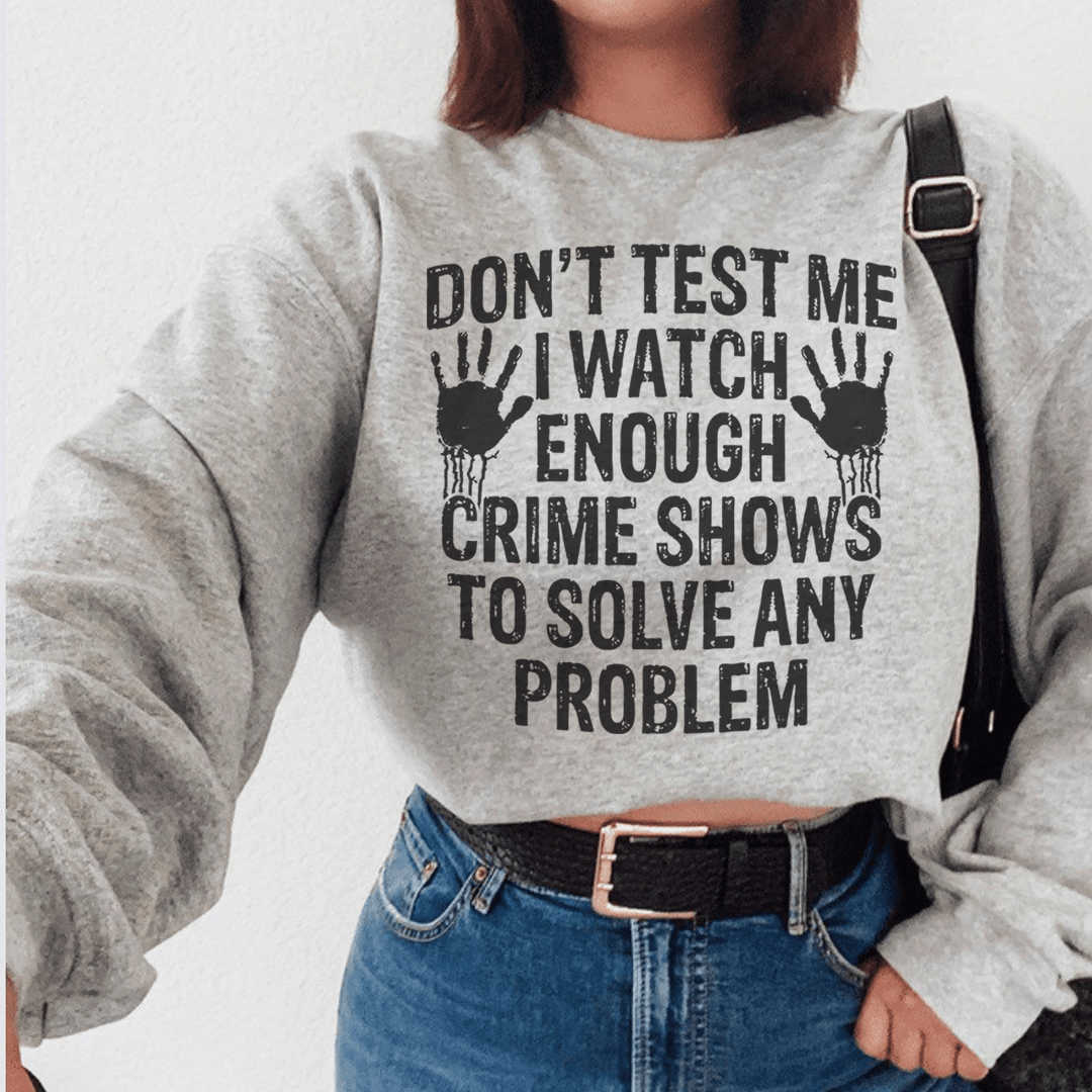 Cozy hoodie featuring the phrase 'I Watch Enough Crime Shows To Solve Any Problem', made from cotton/poly fleece blend.