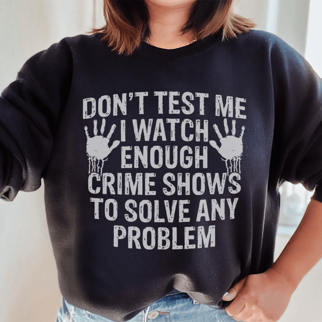 Cozy hoodie featuring the phrase 'I Watch Enough Crime Shows To Solve Any Problem', made from cotton/poly fleece blend.