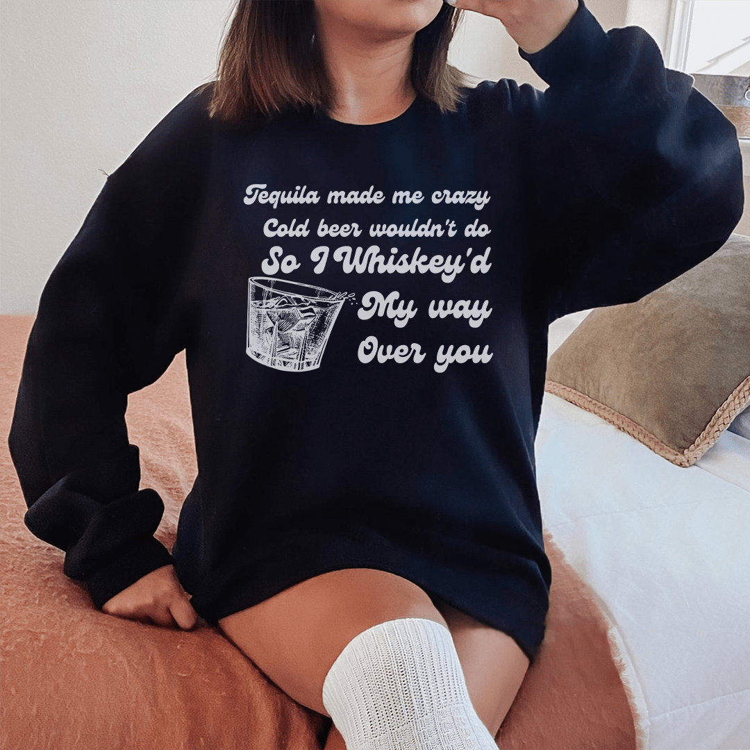 Cozy 'I Whiskey'd My Way Over You' sweatshirt featuring a unique design by top artists, made from a warm cotton/poly fleece blend.