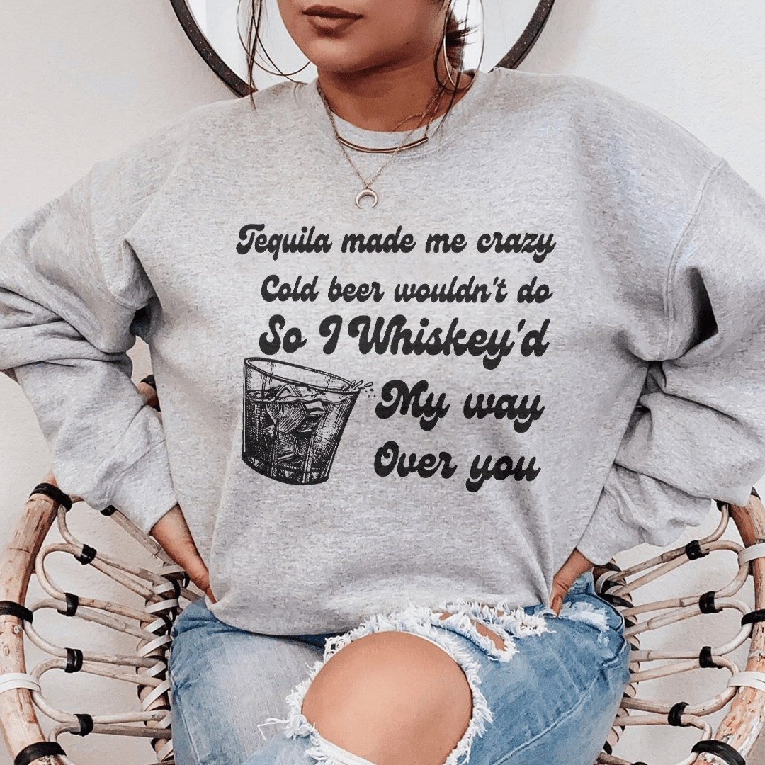 Cozy 'I Whiskey'd My Way Over You' sweatshirt featuring a unique design by top artists, made from a warm cotton/poly fleece blend.