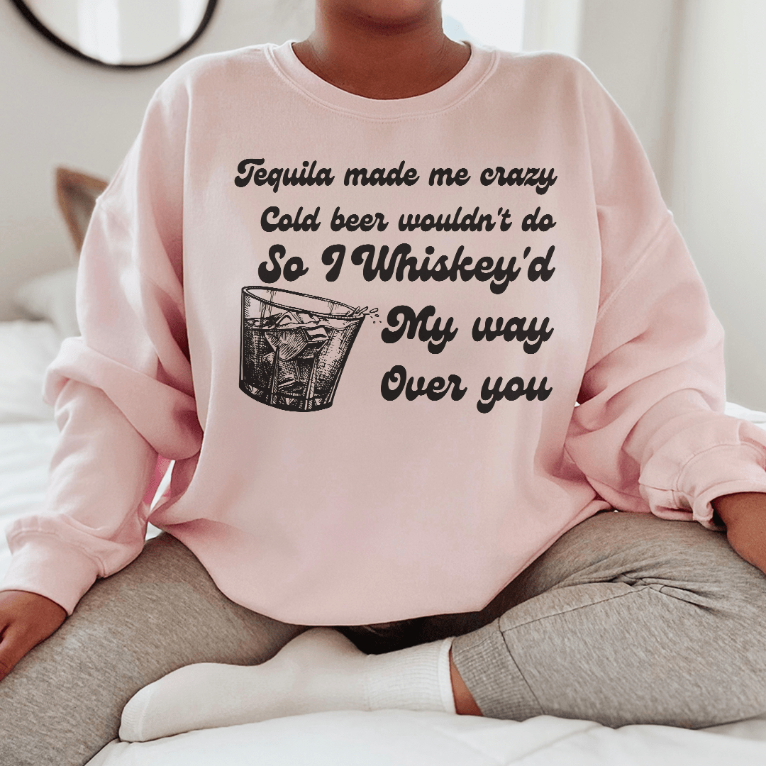 Cozy 'I Whiskey'd My Way Over You' sweatshirt featuring a unique design by top artists, made from a warm cotton/poly fleece blend.