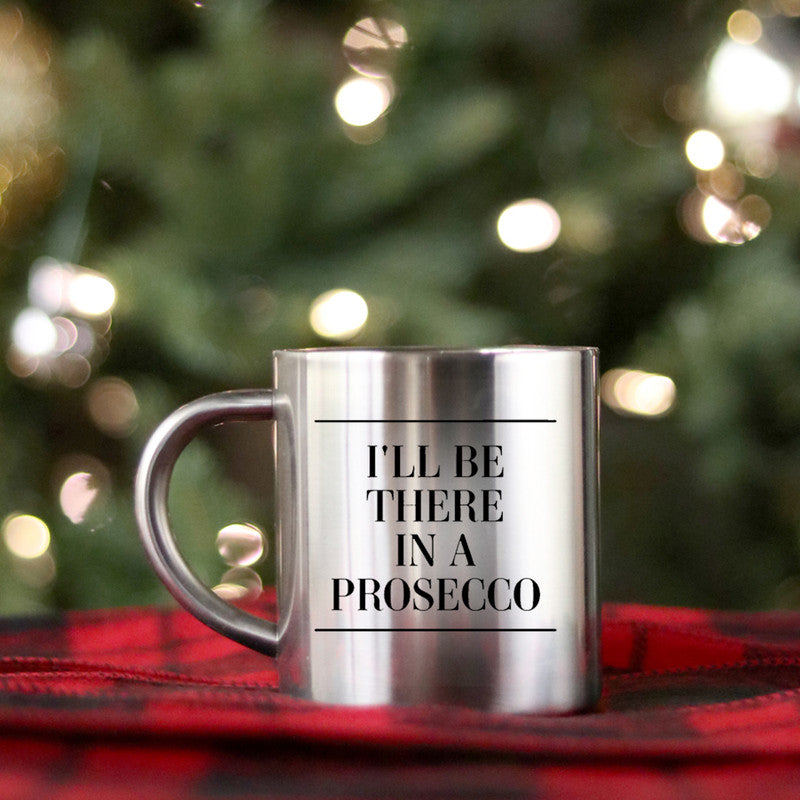 A stylish gold and silver ceramic mug with the phrase 'I'll Be There In A Prosecco' elegantly displayed.