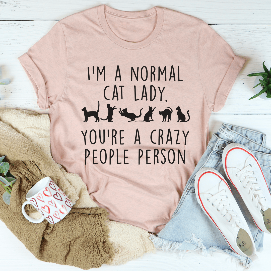 I'm A Normal Cat Lady T-Shirt displayed on a hanger, showcasing its soft fabric and vibrant print.