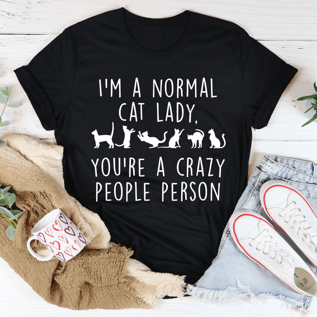 I'm A Normal Cat Lady T-Shirt displayed on a hanger, showcasing its soft fabric and vibrant print.