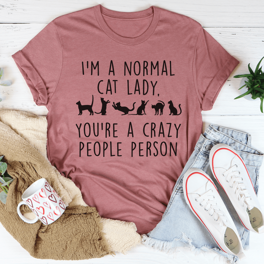 I'm A Normal Cat Lady T-Shirt displayed on a hanger, showcasing its soft fabric and vibrant print.