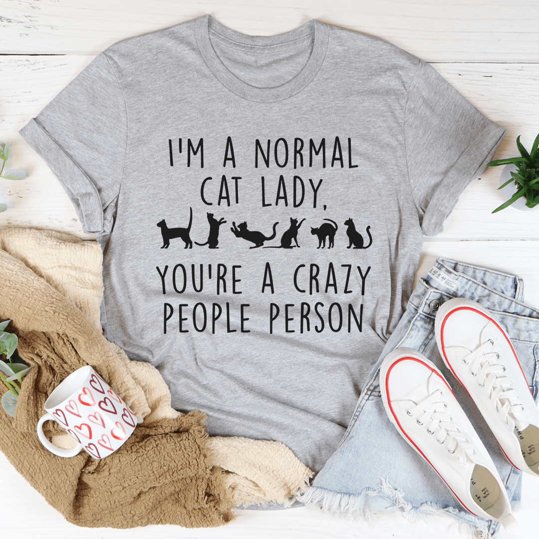 I'm A Normal Cat Lady T-Shirt displayed on a hanger, showcasing its soft fabric and vibrant print.