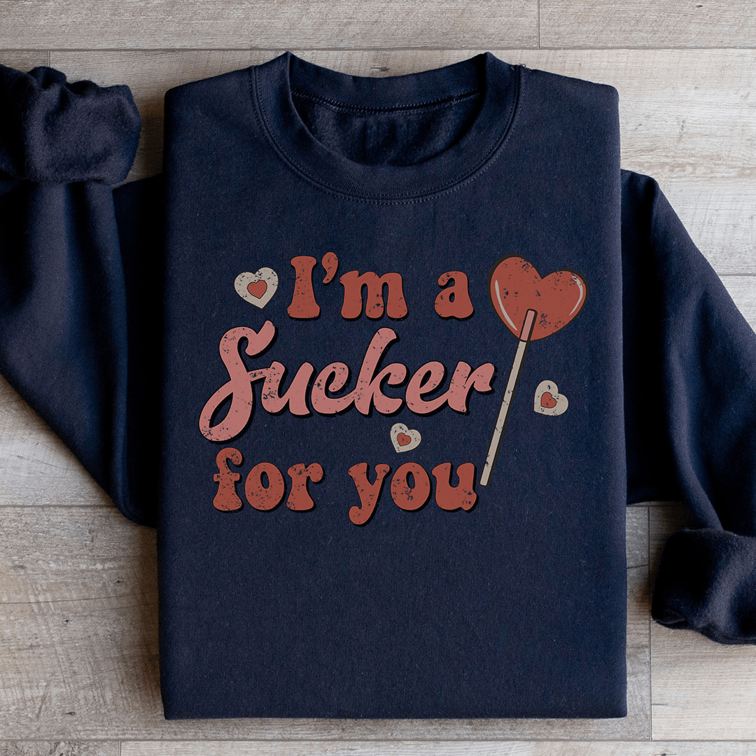 A cozy pair of 'I'm A Sucker For You' sweats featuring a unique design by top artists, made from a warm cotton/poly fleece blend.