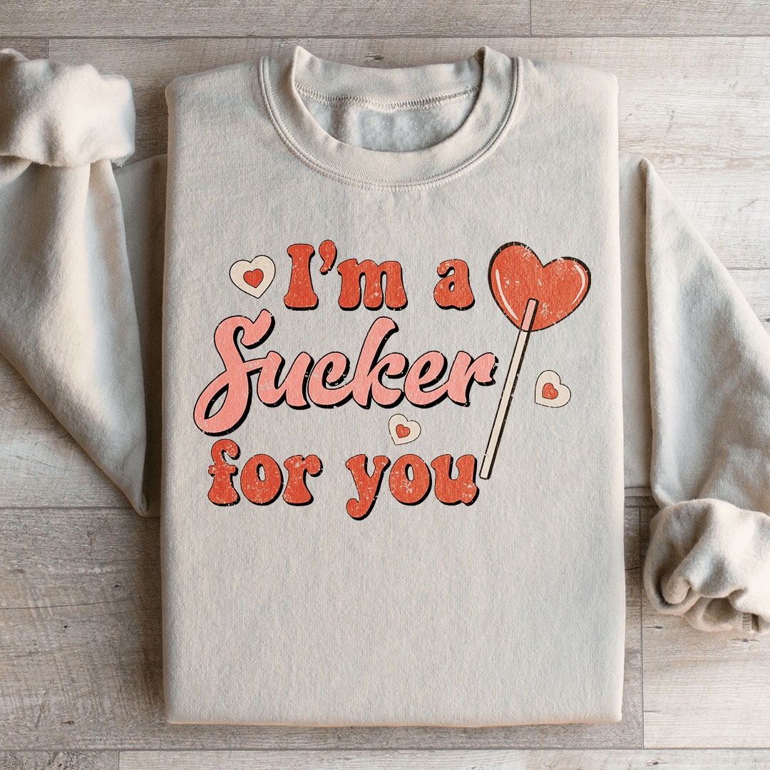 A cozy pair of 'I'm A Sucker For You' sweats featuring a unique design by top artists, made from a warm cotton/poly fleece blend.