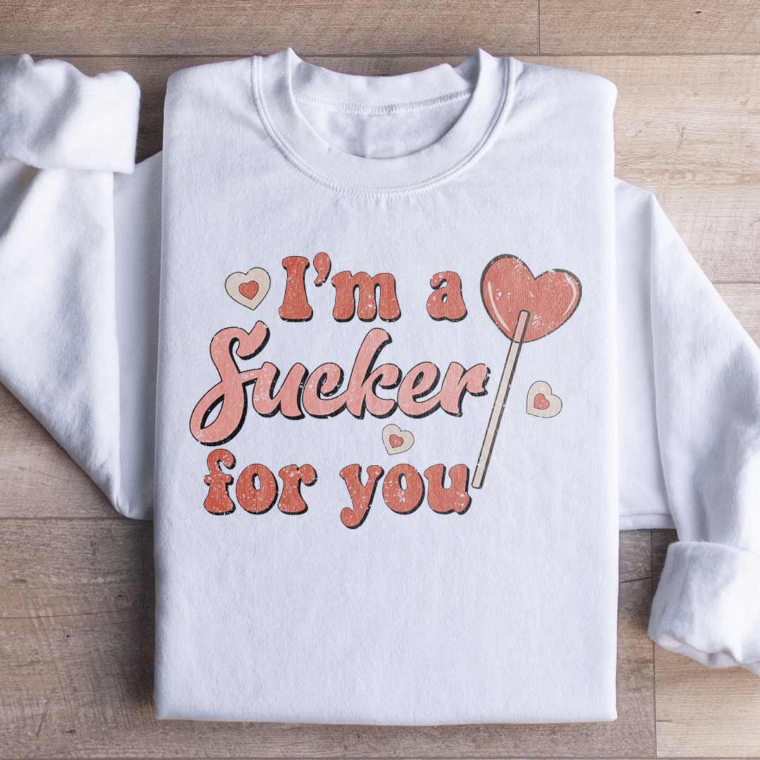 A cozy pair of 'I'm A Sucker For You' sweats featuring a unique design by top artists, made from a warm cotton/poly fleece blend.