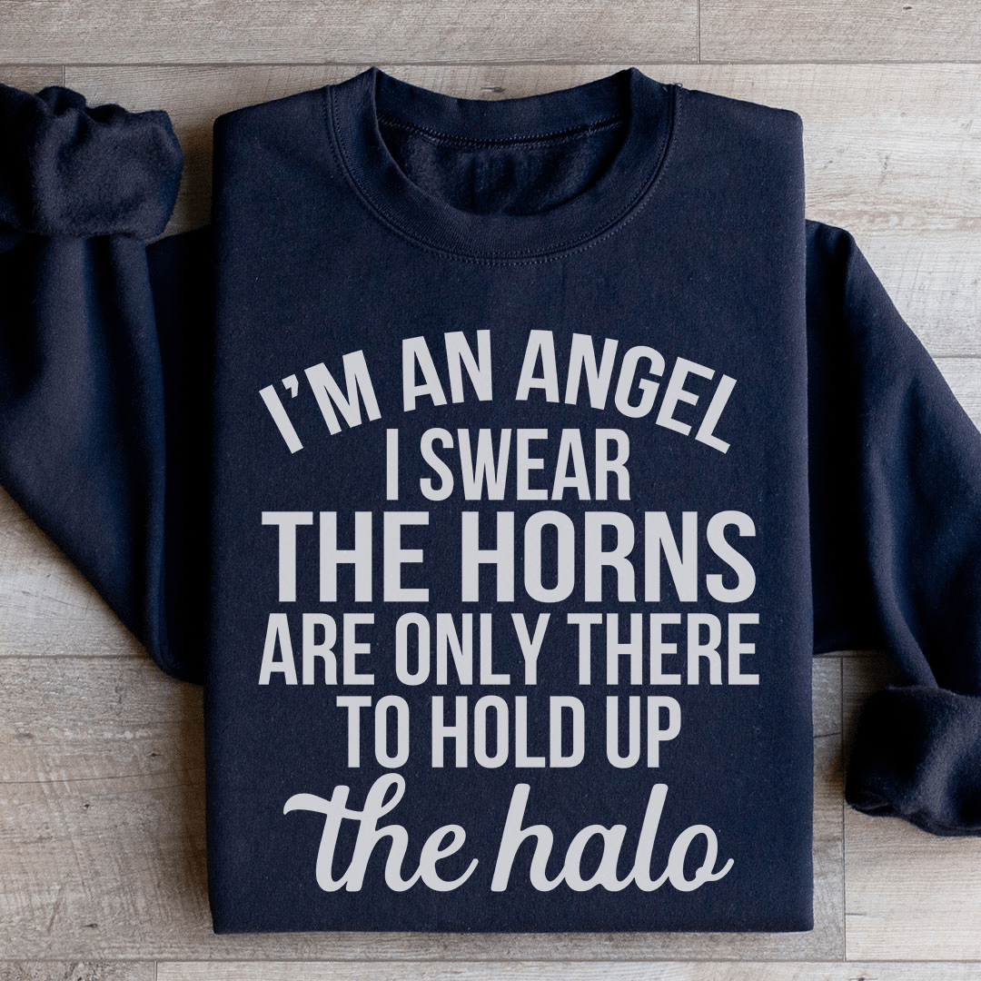 A cozy 'I'm An Angel I Swear' sweatshirt featuring a unique design by top artists, made from a soft cotton/poly fleece blend.