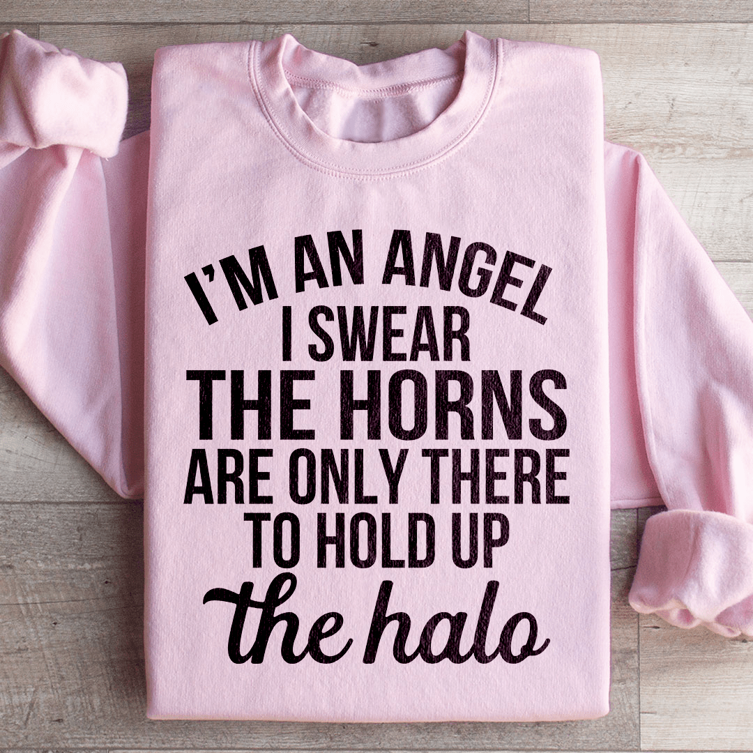 A cozy 'I'm An Angel I Swear' sweatshirt featuring a unique design by top artists, made from a soft cotton/poly fleece blend.