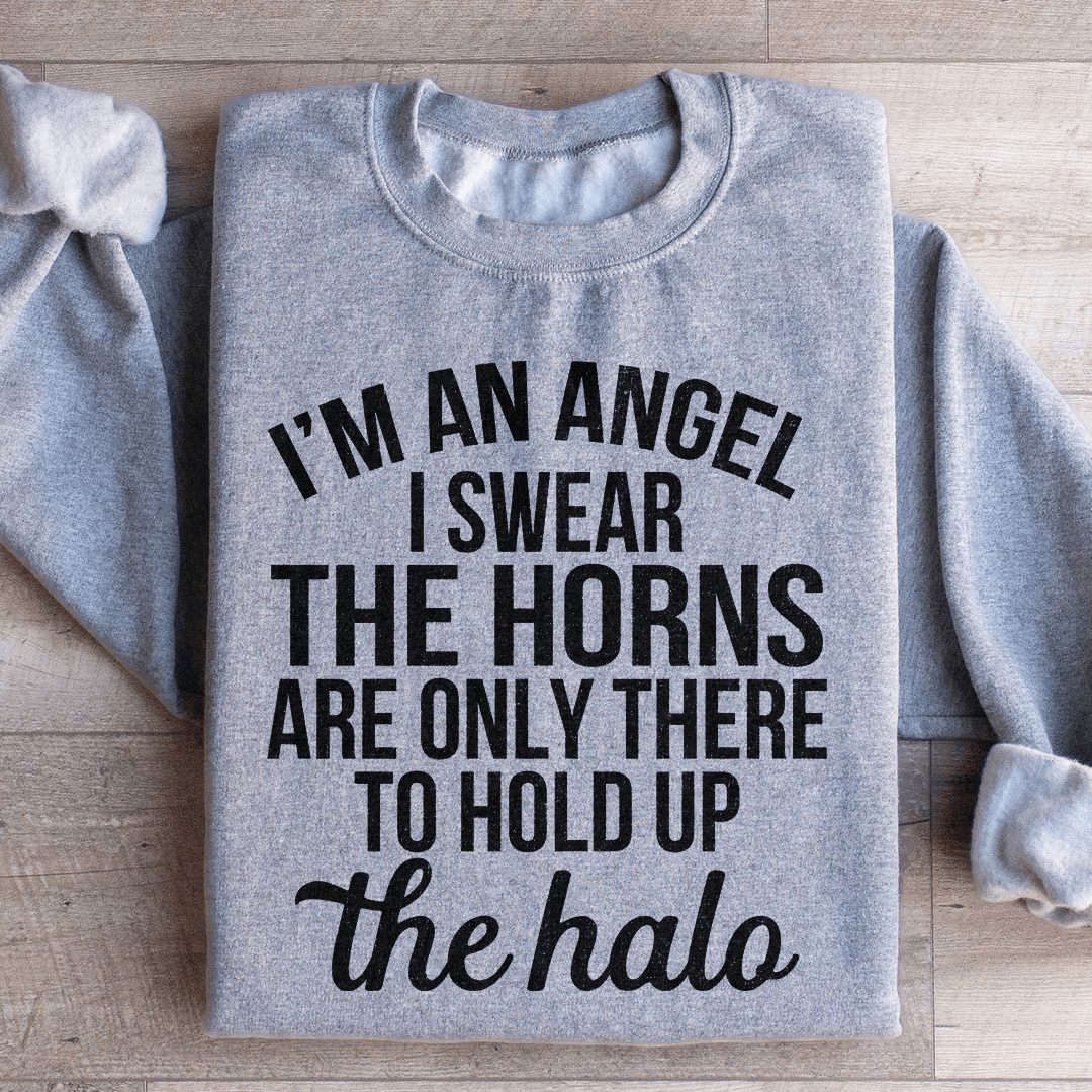 A cozy 'I'm An Angel I Swear' sweatshirt featuring a unique design by top artists, made from a soft cotton/poly fleece blend.