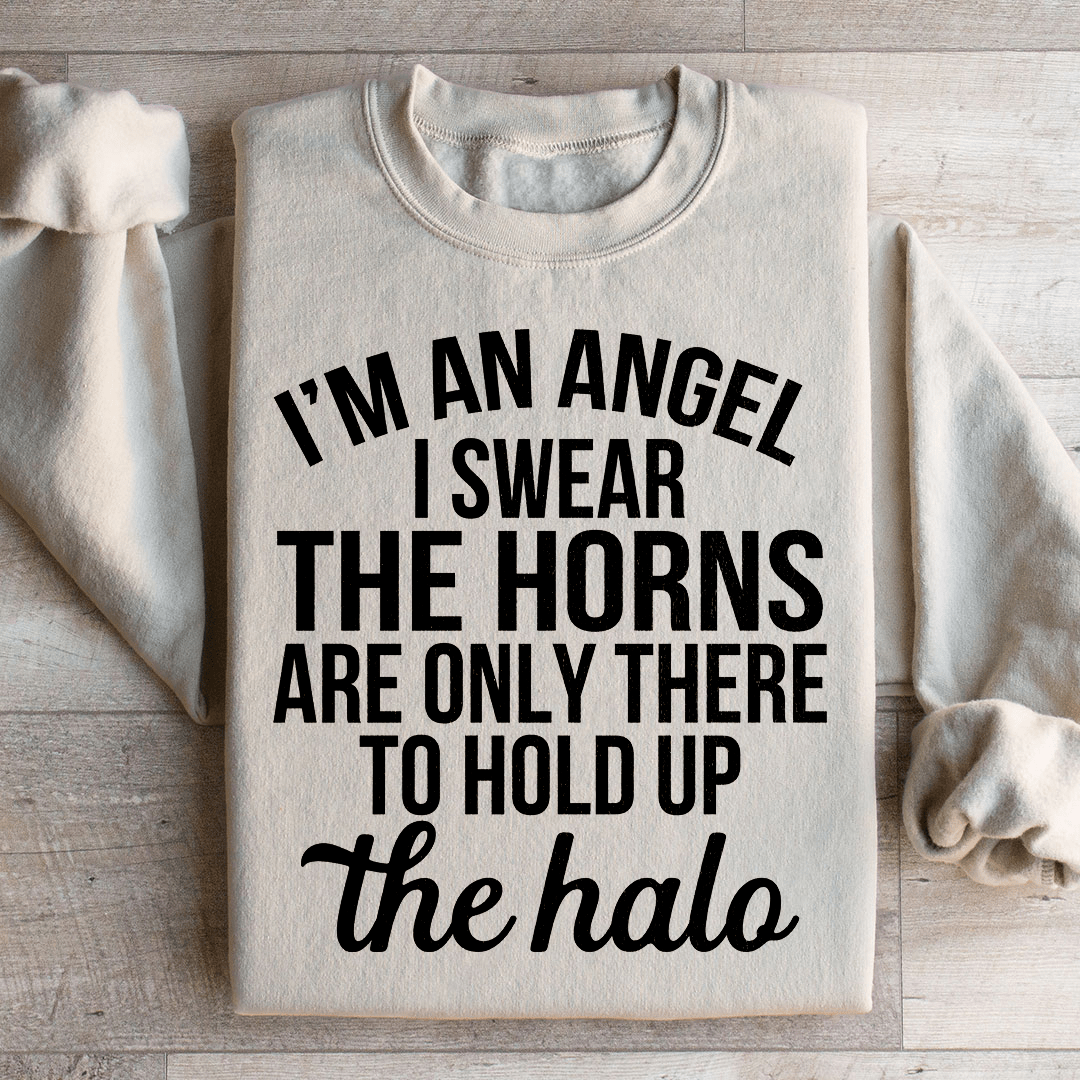 A cozy 'I'm An Angel I Swear' sweatshirt featuring a unique design by top artists, made from a soft cotton/poly fleece blend.