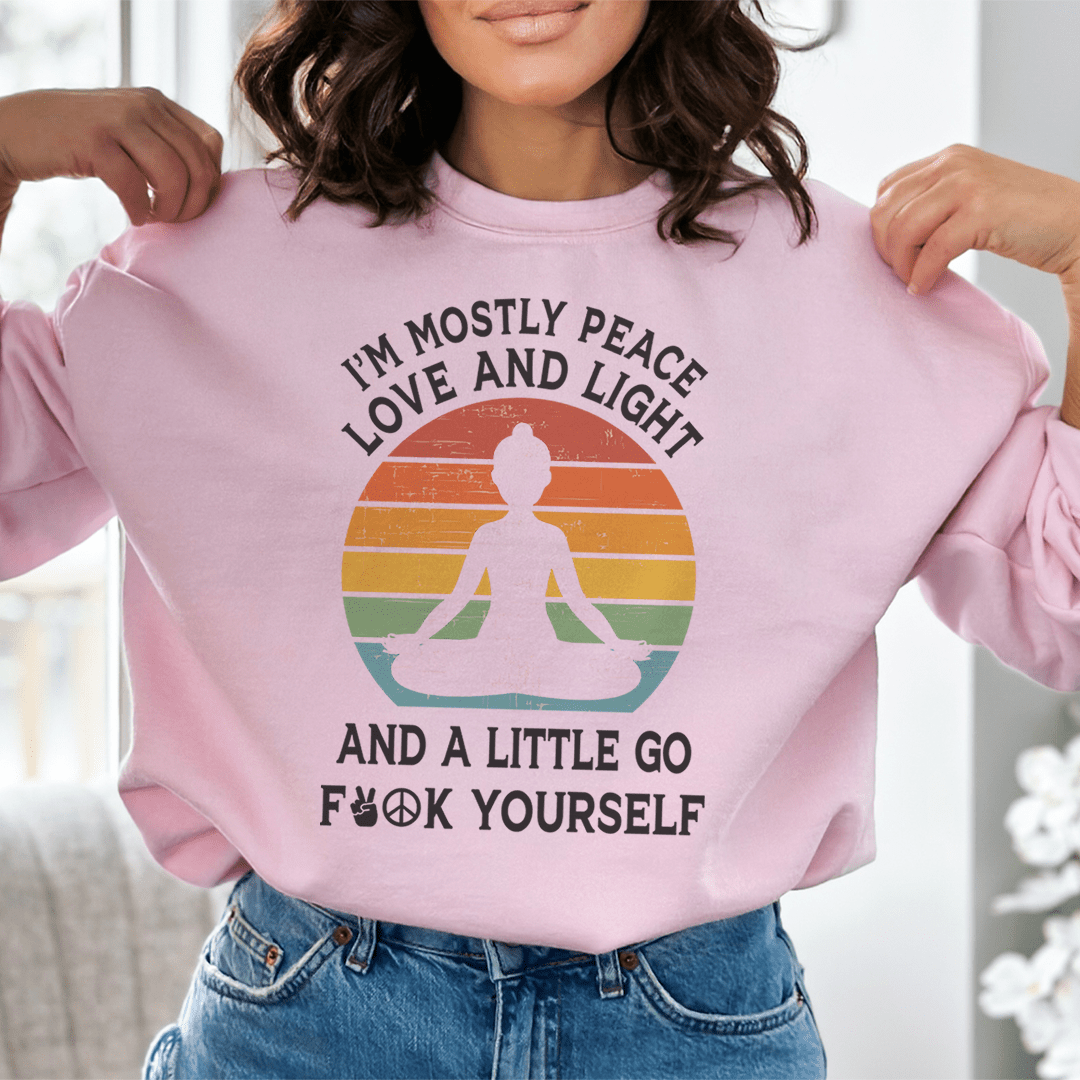 A cozy hoodie featuring the phrase 'I'm Mostly Peace Love And Light' designed by top artists, showcasing vibrant colors and a comfortable fit.