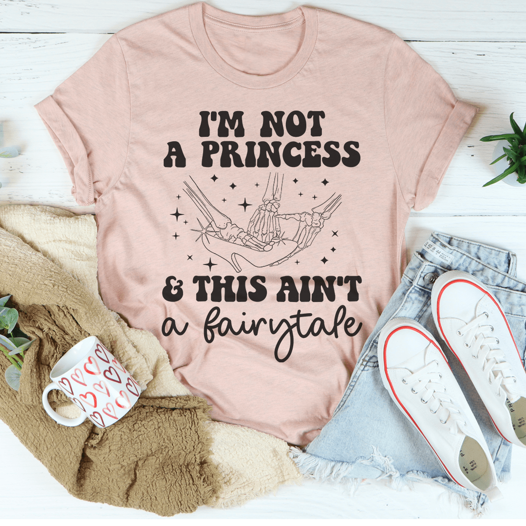 A stylish black t-shirt with the phrase 'I'm Not A Princess & This Ain't A Fairytale' printed in bold white letters, showcasing its comfortable fit and quality fabric.