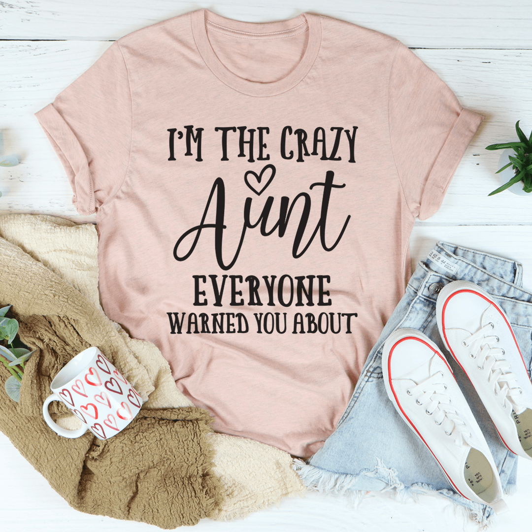 I'm The Crazy Aunt Tee, a soft cotton t-shirt with a playful design, showcasing durability and comfort.