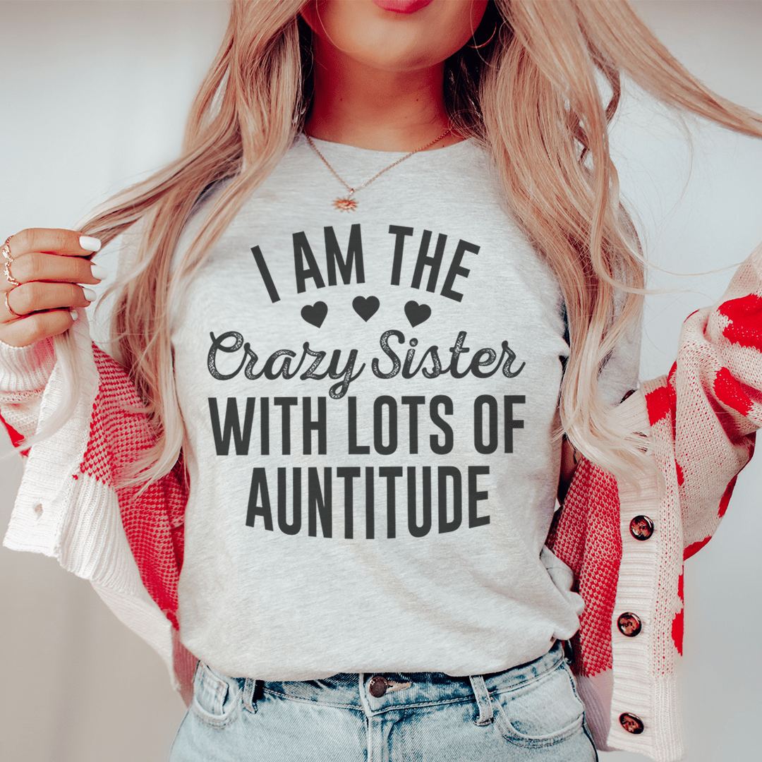 I'm The Crazy Sister With Lots Of Auntitude Tee, featuring a playful design on a soft cotton fabric, perfect for casual wear.