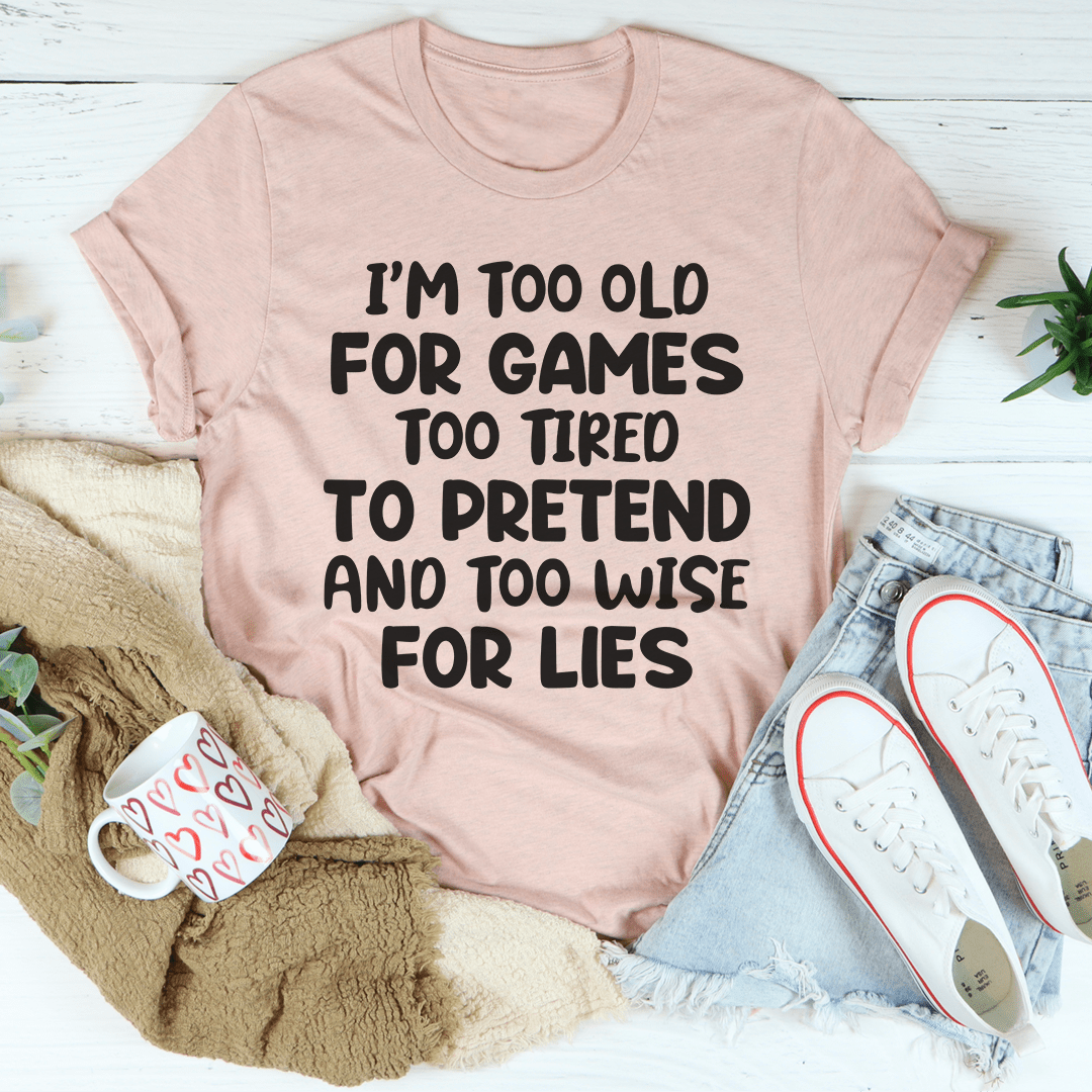 A comfortable and stylish 'I'm Too Old For Games Tee' made from soft ring-spun cotton, featuring a playful slogan.