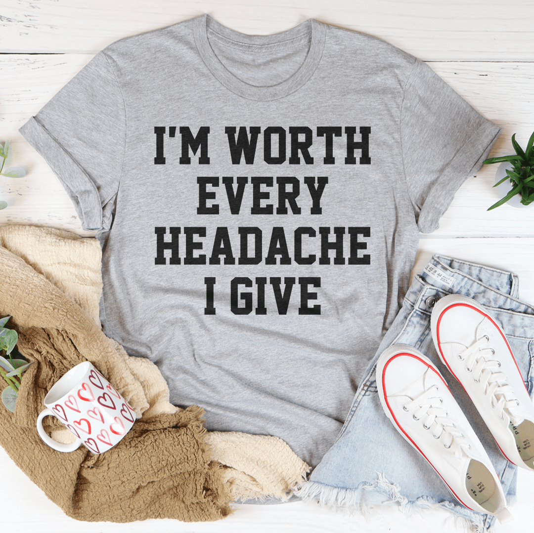 A stylish black t-shirt featuring the phrase 'I'm Worth Every Headache I Give' in bold lettering, showcasing its soft fabric and durable stitching.