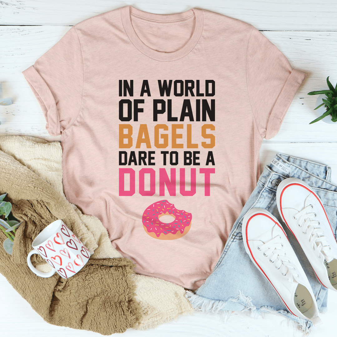 In A World Of Plain Bagels Tee, a soft cotton t-shirt with double stitching, available in various sizes.