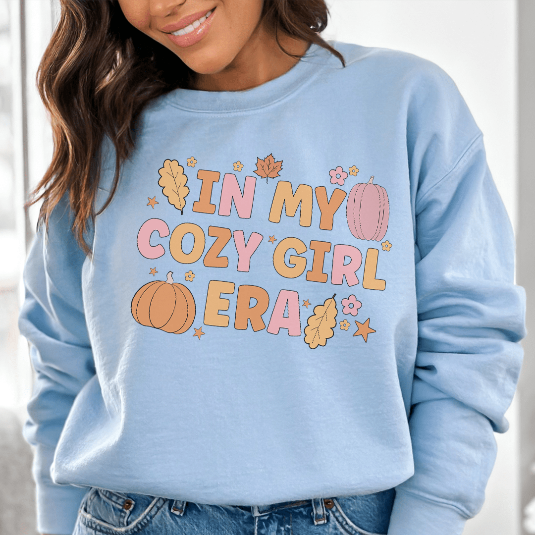 Cozy girl era sweats featuring a unique design by top artists, made from a warm cotton/poly fleece blend with adjustable cuffs.