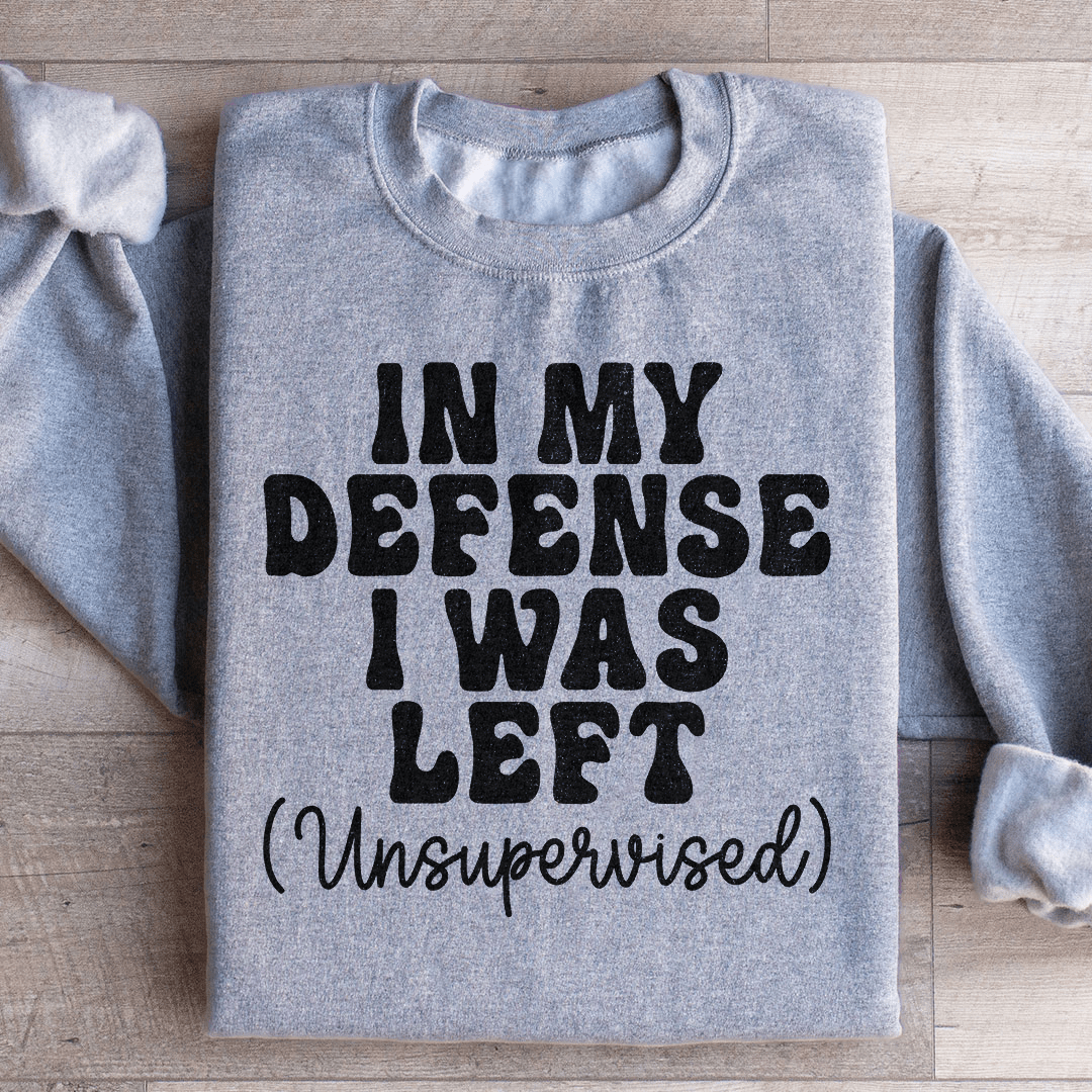 Cozy 'In My Defense I Was Left Unsupervised' sweats featuring a unique design by top artists, made from a warm cotton/poly fleece blend.