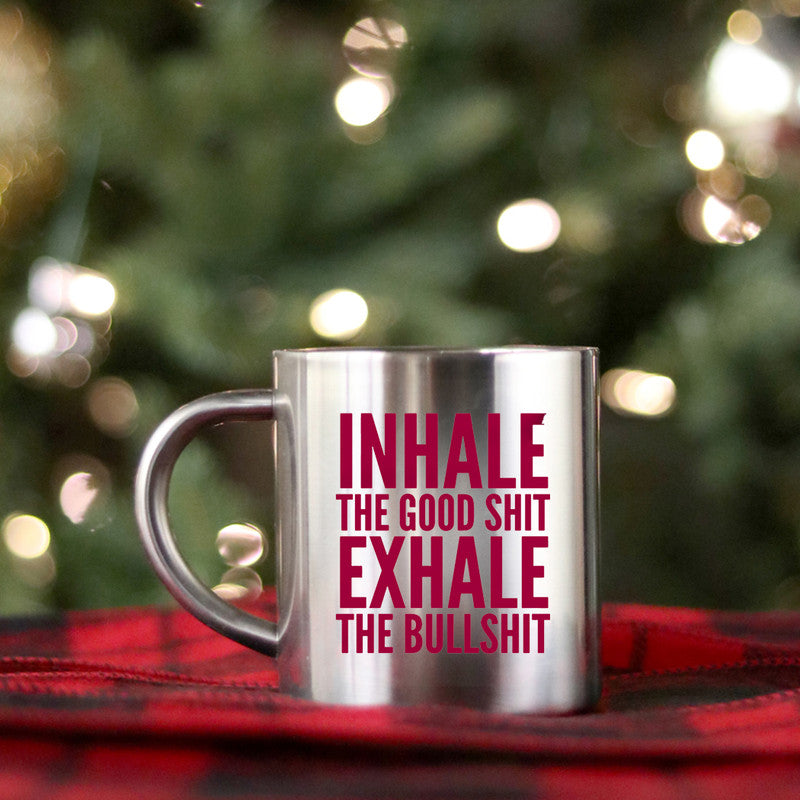 Ceramic mug with gold metallic coating featuring the phrase 'Inhale The Good Shit Exhale The Bullshit' in stylish typography.