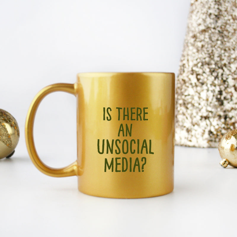 A stylish Unsocial Media Gold & Silver Mug with a luxurious gold metallic coating, perfect for beverages.