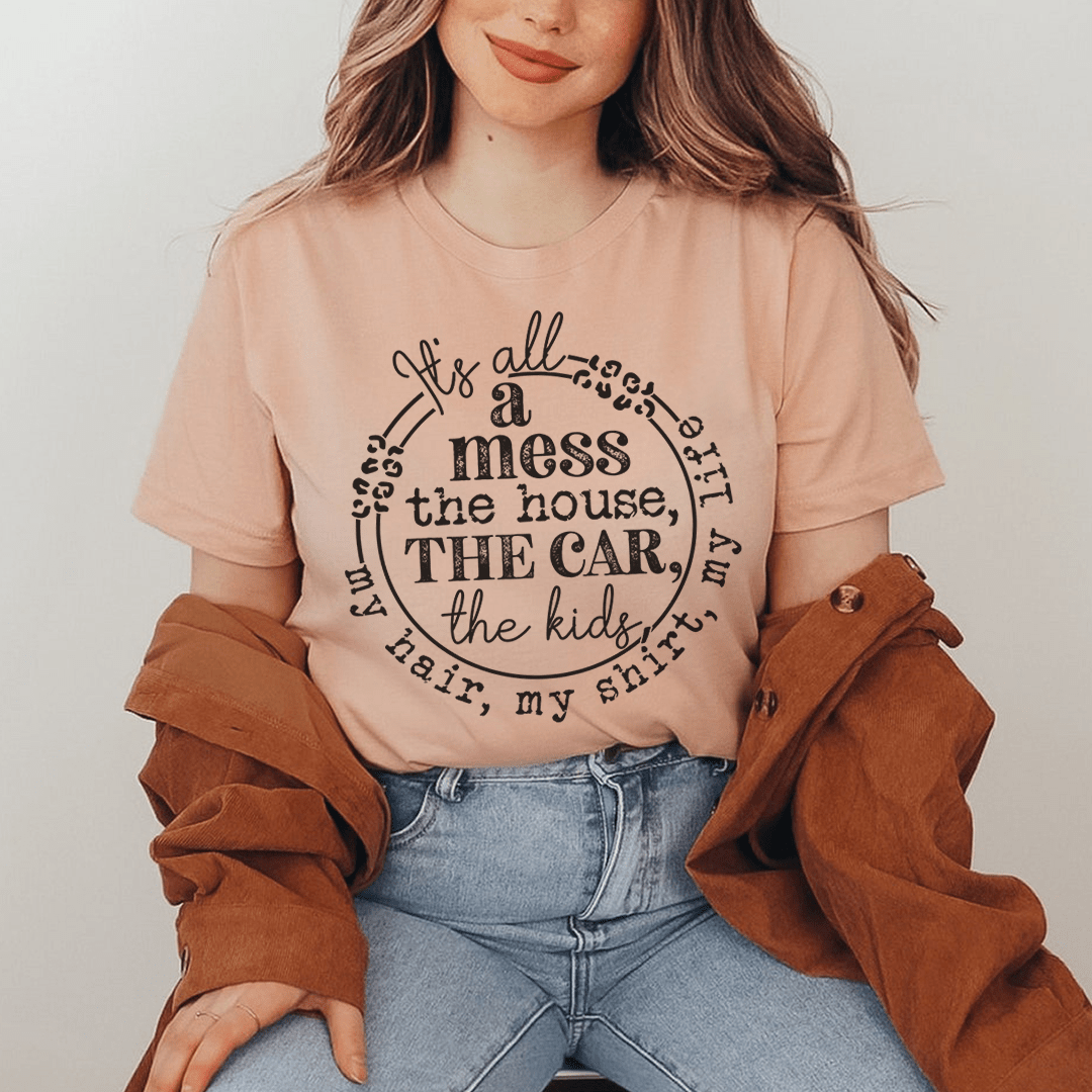 A stylish It's All A Mess Tee made from soft ring-spun cotton, featuring double stitching for durability, available in various sizes.