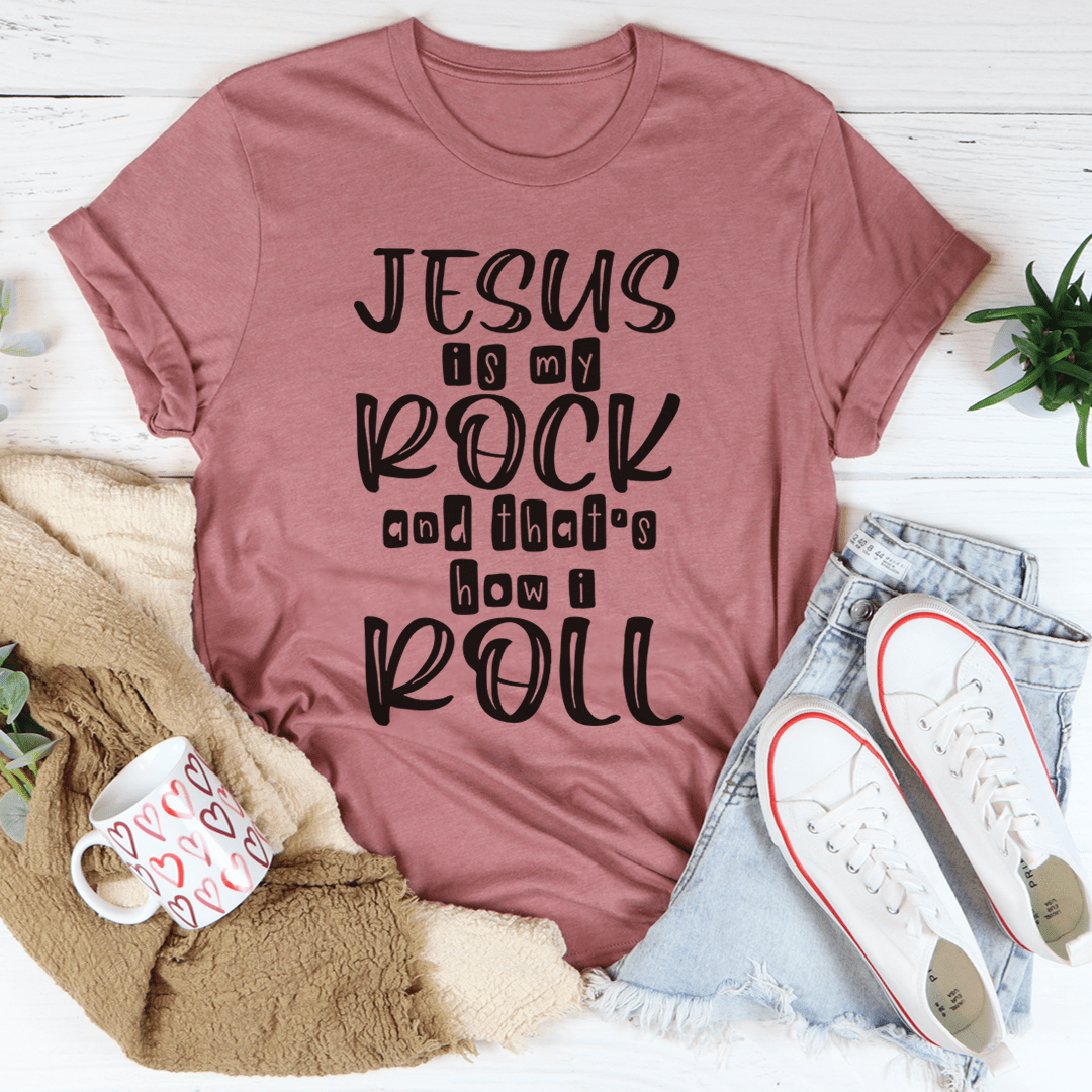 A comfortable Jesus Is My Rock And That's How I Roll Tee made of soft ring-spun cotton, featuring a durable design with double stitching.