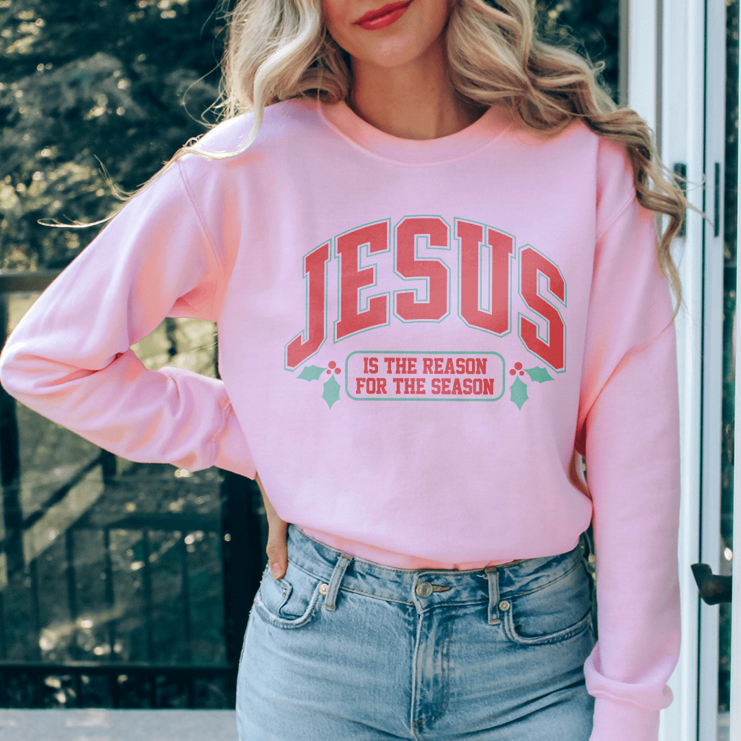 A cozy hoodie featuring the phrase 'Jesus Is The Reason For The Season', made from a warm cotton/poly fleece blend.