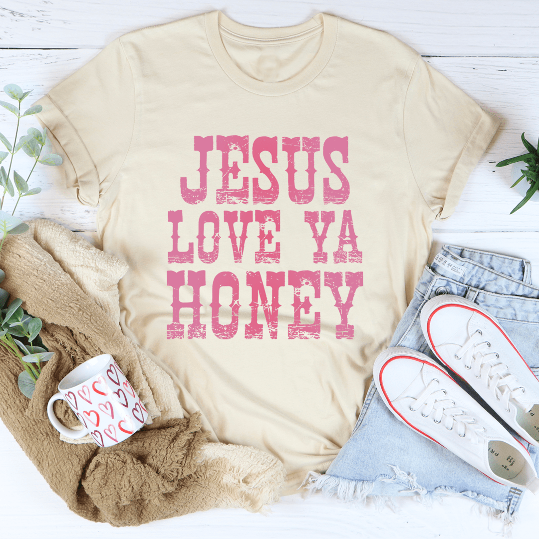 A soft and durable Jesus Love Ya Honey Tee in various colors, showcasing its comfortable fabric and stylish design.