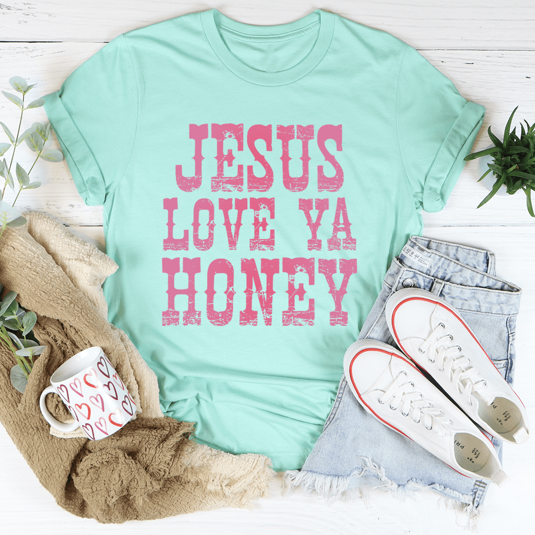 A soft and durable Jesus Love Ya Honey Tee in various colors, showcasing its comfortable fabric and stylish design.