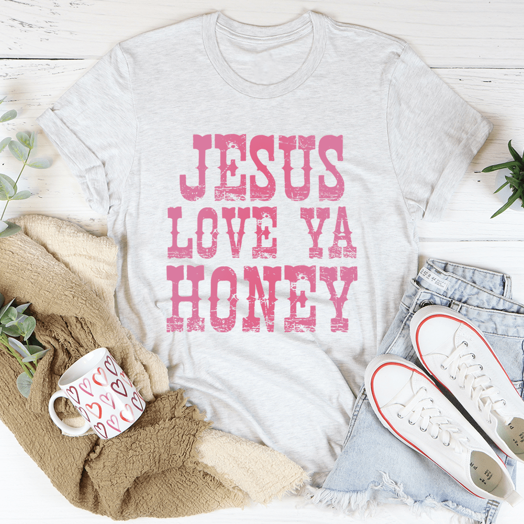 A soft and durable Jesus Love Ya Honey Tee in various colors, showcasing its comfortable fabric and stylish design.